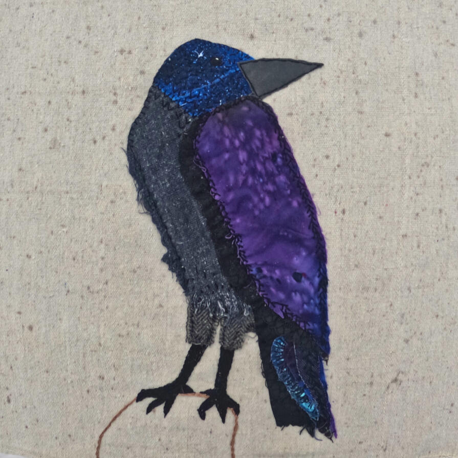 slow stitched crow on repurposed canvas